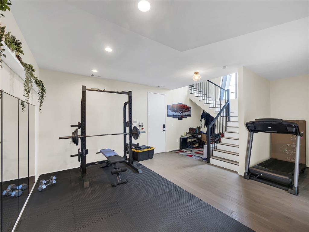 4703 Munger Avenue, Unit 101 Dallas, TX 75204 - Photo 18 of 26 a view of a room with gym equipment