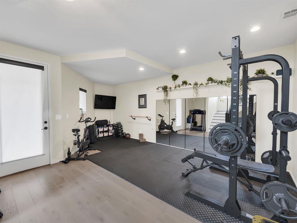4703 Munger Avenue, Unit 101 Dallas, TX 75204 - Photo 19 of 26 a view of a room with gym equipment