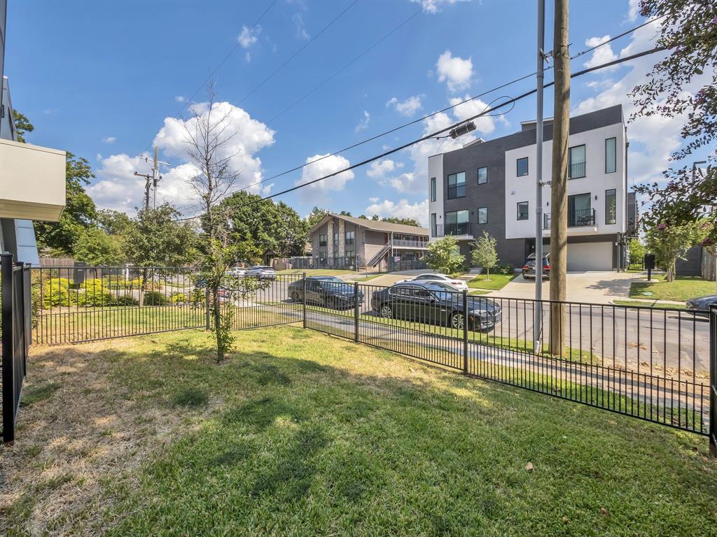 4703 Munger Avenue, Unit 101 Dallas, TX 75204 - Photo 22 of 26 a view of a house with backyard and a tree
