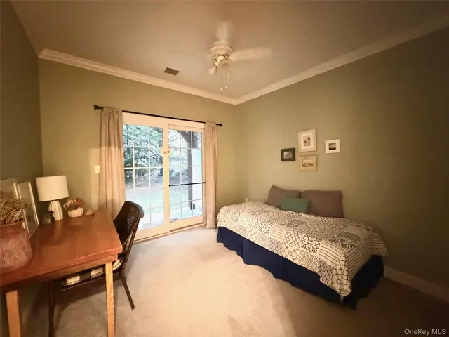 a bedroom with a bed and a desk