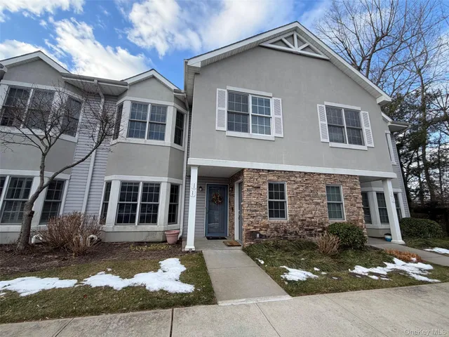 a front view of a house with yard