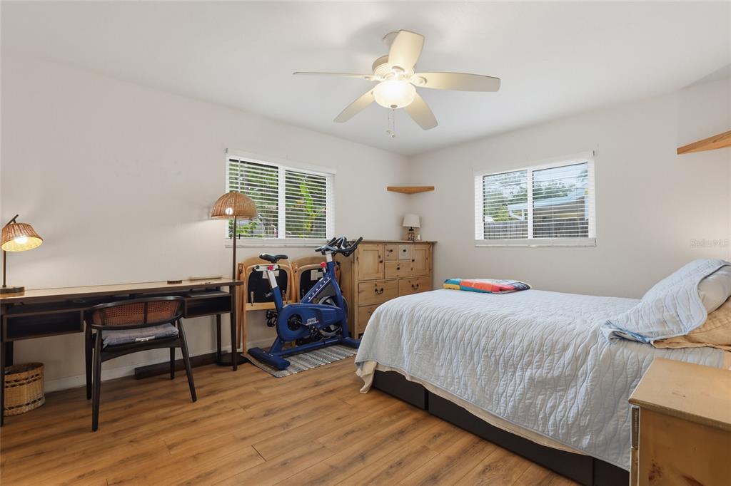 4576 Bliss Road Sarasota, FL 34233 - Photo 23 of 40 a bedroom with two beds and a desk