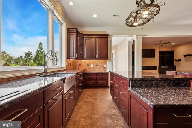 a kitchen with stainless steel appliances granite countertop a stove and a refrigerator