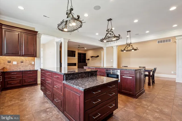 a view of a livingroom with a ceiling fan and window
