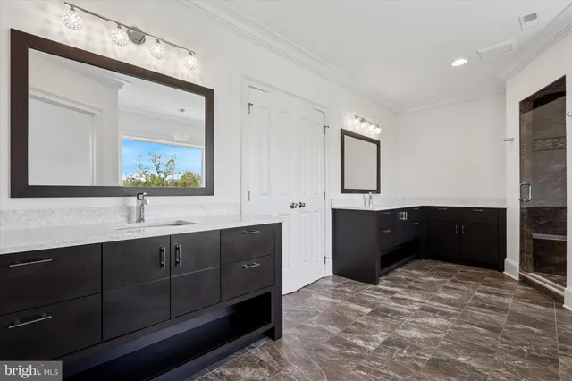 a bathroom with a granite countertop sink a toilet and mirror