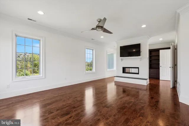 a spacious bathroom with a shower a sink mirror and shower