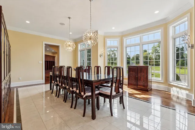 a view of a room with wooden floor and furniture