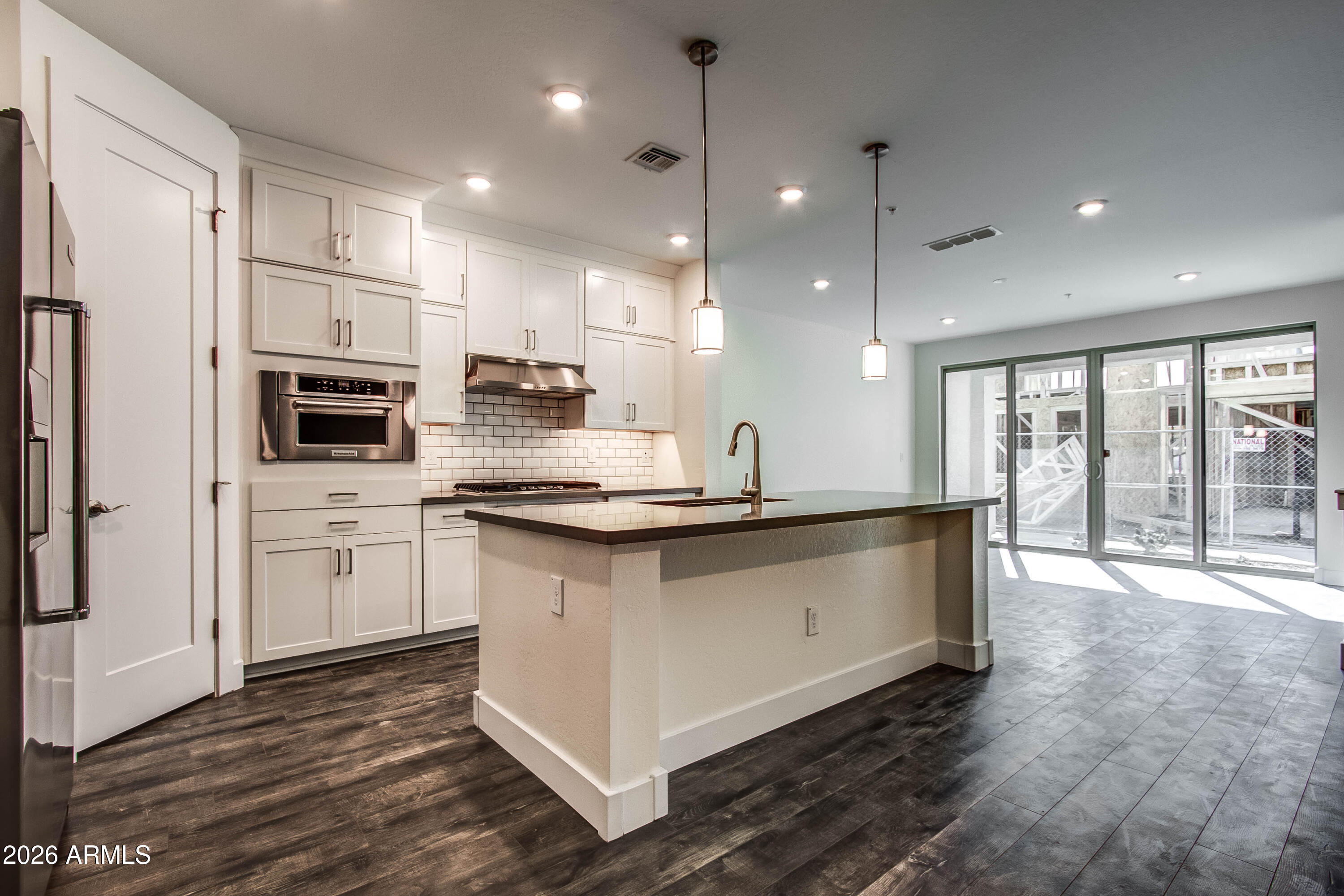 3855 South McQueen Road, Unit 50 Chandler, AZ 85286 - Photo 5 of 14 a large kitchen with stainless steel appliances granite countertop a large counter top a stove and a refrigerator
