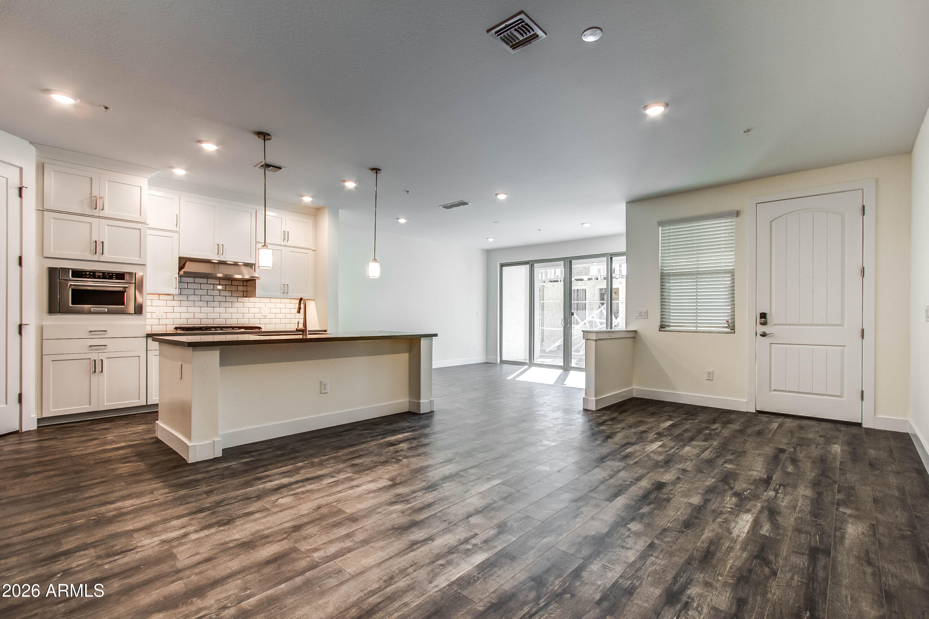 3855 South McQueen Road, Unit 50 Chandler, AZ 85286 - Photo 7 of 14 a large kitchen with a lot of counter space and stainless steel appliances