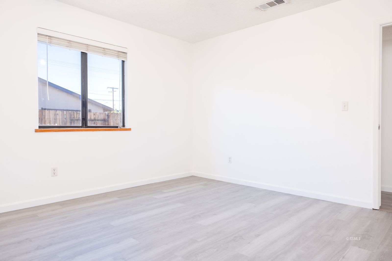 820 Walker Lane Ridgecrest, CA 93555 - Photo 20 of 27 a view of a small space with wooden floor and a window