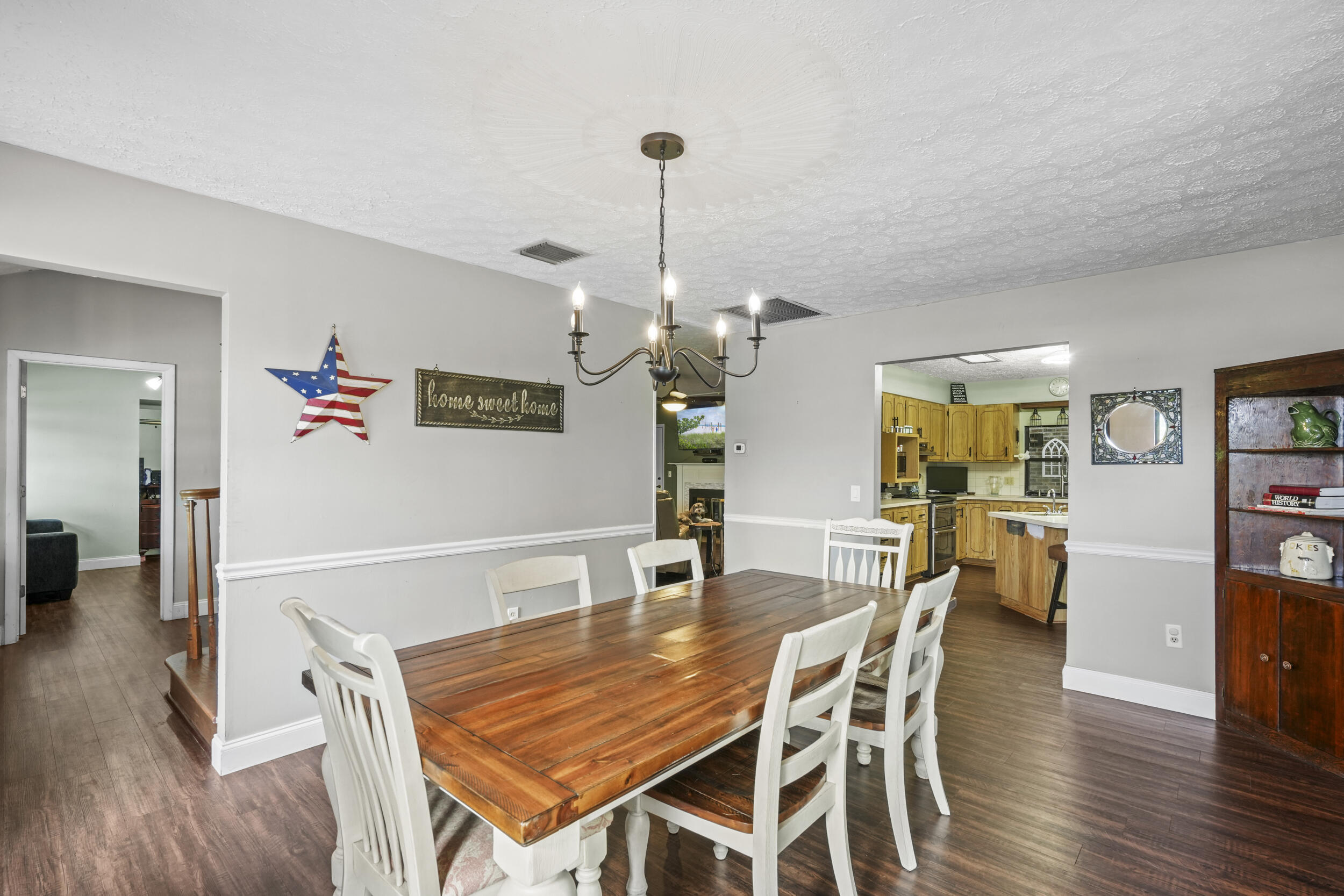 4170 McCarty Road Fort Pierce, FL 34945 - Photo 24 of 57 a dining room with furniture and wooden floor