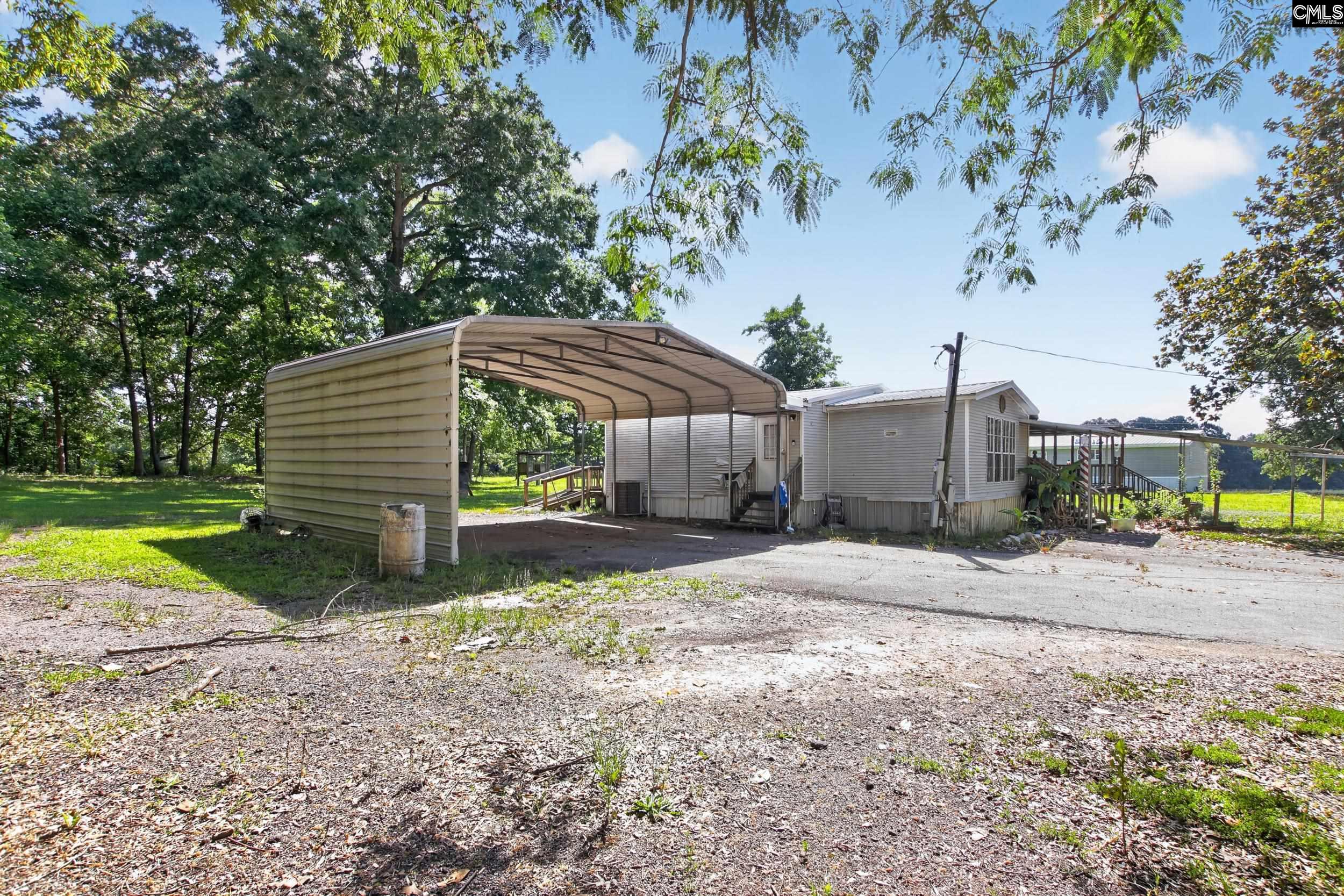 3140 Highway 702 Chappells, SC 29037 - Photo 24 of 39 a view of a house with backyard and sitting area