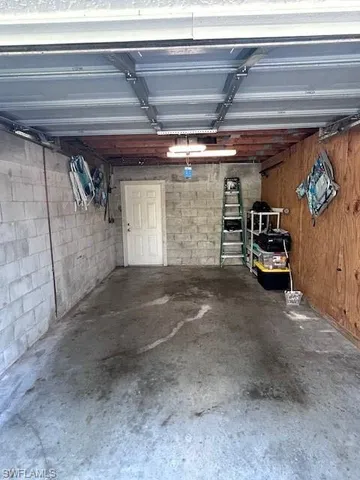 a view of parking garage with cars