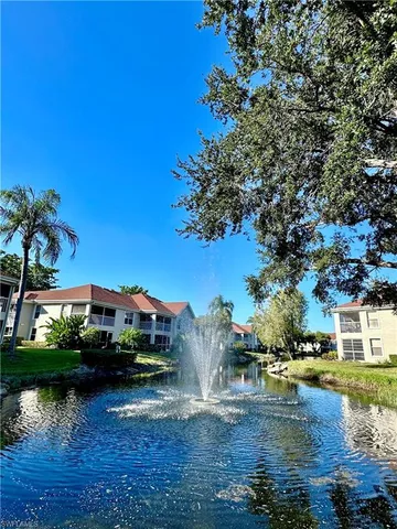 a swimming pool view with a lake view