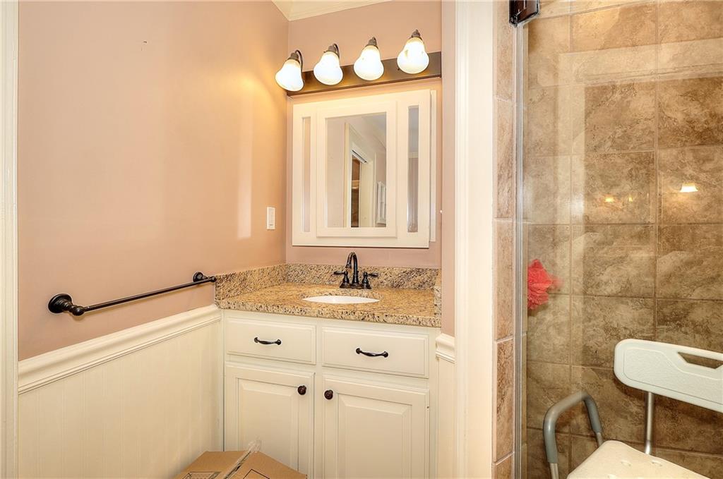 317 North Cherokee Road Social Circle, GA 30025 - Photo 21 of 32 a bathroom with a sink vanity and a mirror