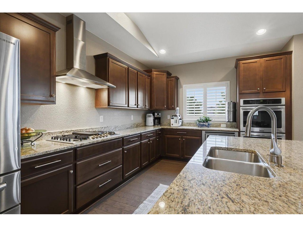 6096 Story Road Timnath, CO 80547 - Photo 12 of 50 a kitchen with a stove and a sink