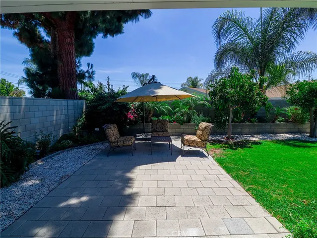 a view of a backyard with sitting area