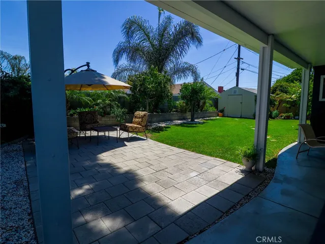 a view of a backyard with sitting area
