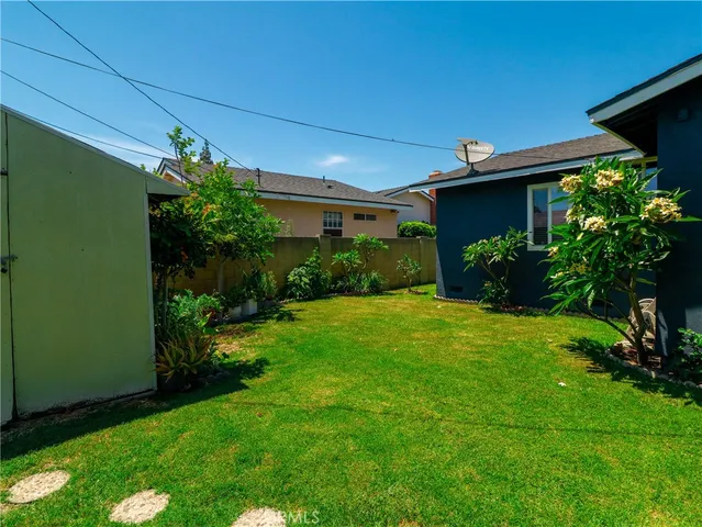 a view of a house with garden and plants