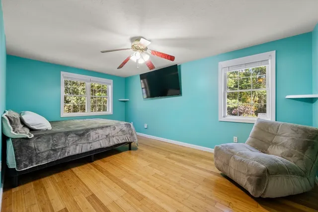 a bedroom with a bed and a couch