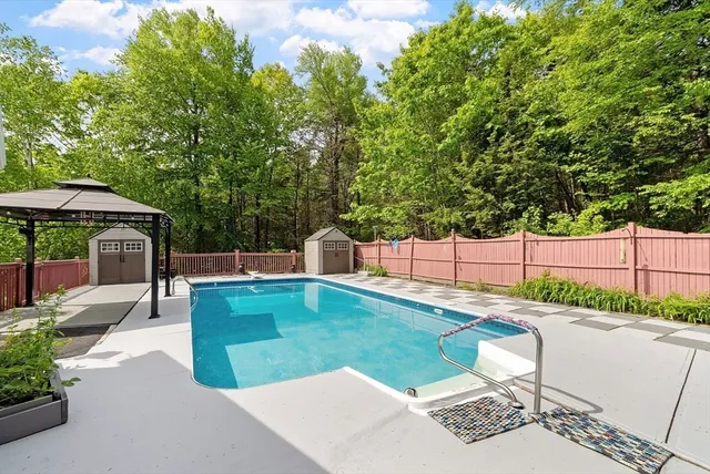a view of a backyard with sitting area