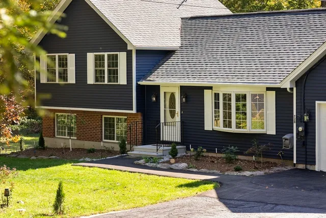 a view of a house with swimming pool and porch