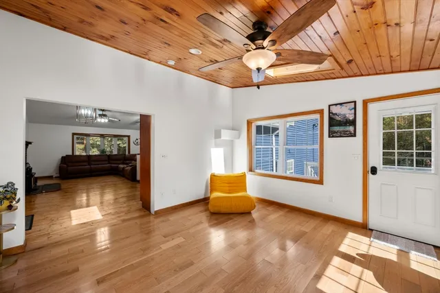a view of an entryway with wooden floor