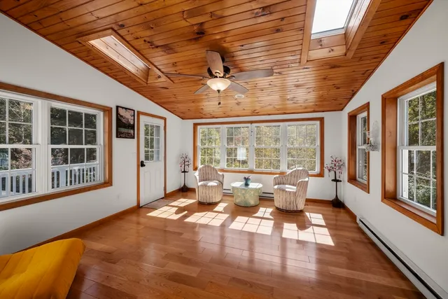 a living room with furniture and windows