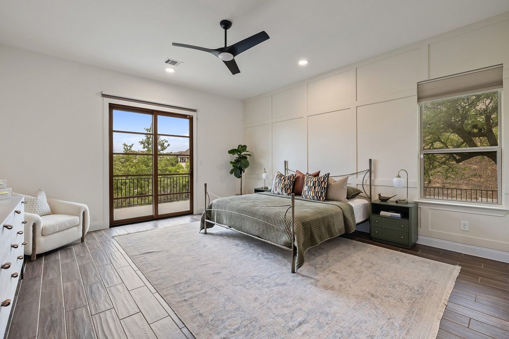 17641 Stratus Cove Dripping Springs, TX 78620 - Photo 20 of 40 a spacious bedroom with a bed and a window