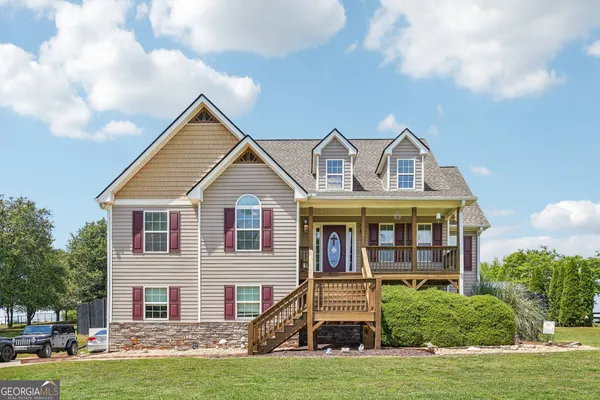 a front view of a house with a yard