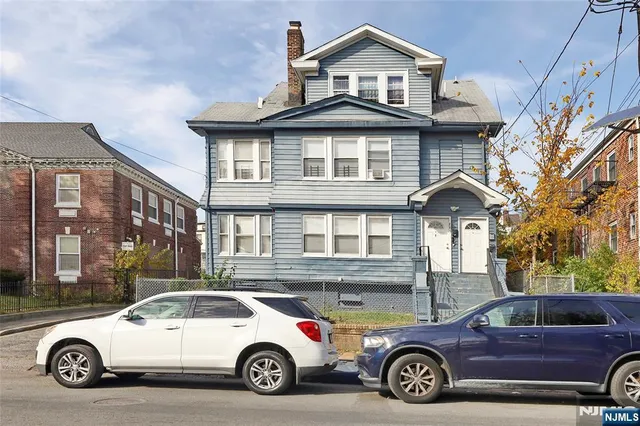 a car parked in front of a house