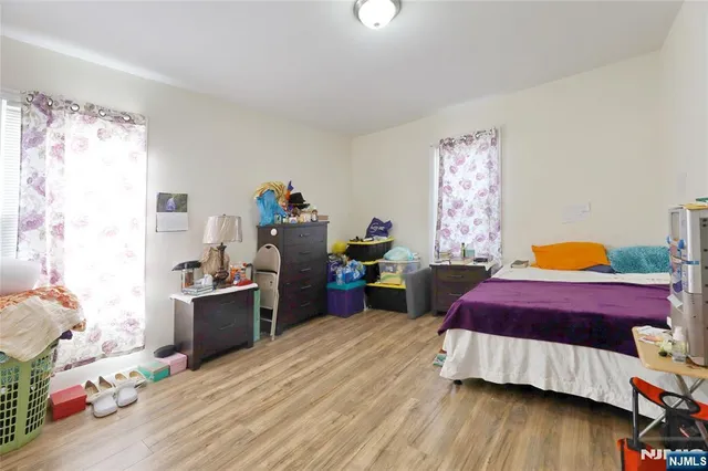 a bed room with a bed and a window