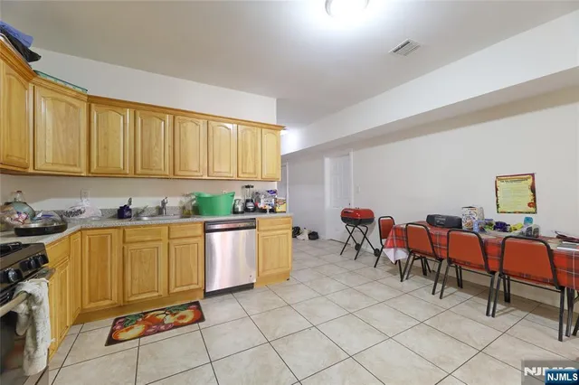 a large kitchen with lots of counter top space and windows