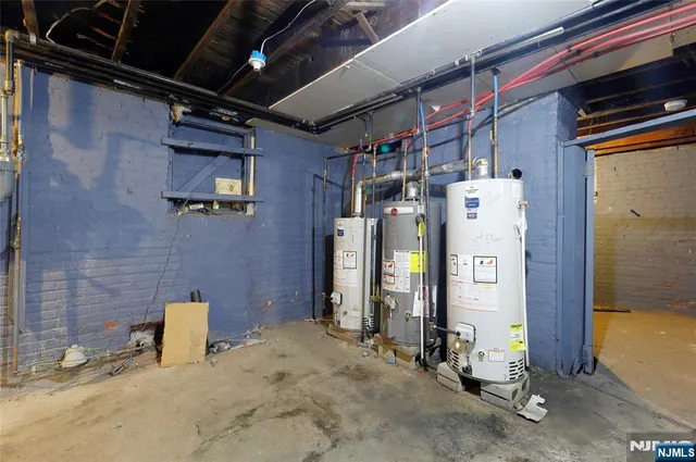 a bathroom with mirror and shower