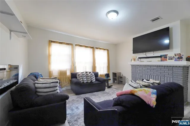 a bedroom with a bed and a mirror