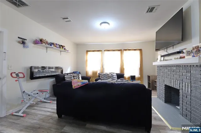 a view of a room with window and furniture