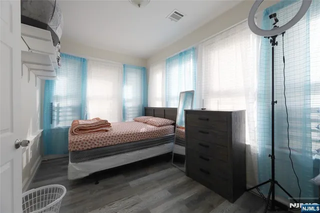 a kitchen with stainless steel appliances a stove a sink cabinets and a refrigerator