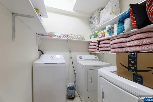 a bedroom with furniture and wooden floor