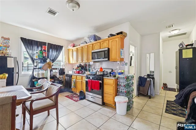 a living room with lots of furniture and a flat screen tv