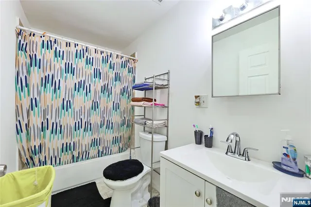 a bedroom with a bed and a table in it