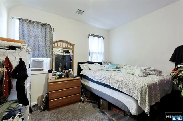 a bedroom with a bed and a table