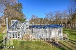 181 East Pleasant Grove Road Jackson, NJ 08527 - Photo 25 of 27 a balcony with trees in the back yard
