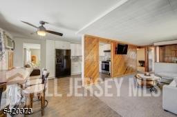 181 East Pleasant Grove Road Jackson, NJ 08527 - Photo 3 of 27 a living room with furniture and a chandelier