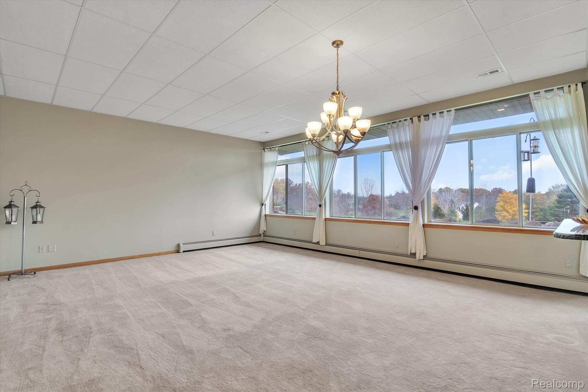 4211 Crandall Road Howell, MI 48855 - Photo 9 of 42 Great Room with expanse of windows