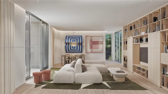 a living room with furniture and a book shelf