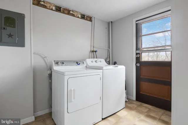 a utility room with dryer and washer