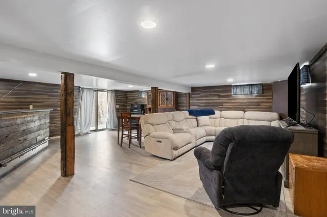 a view of a room with furniture and window