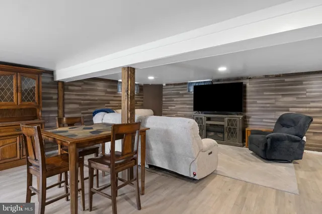 a view of backyard with seating space and trees