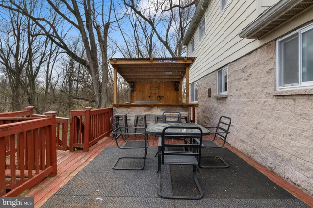 a view of a house with a yard and trees