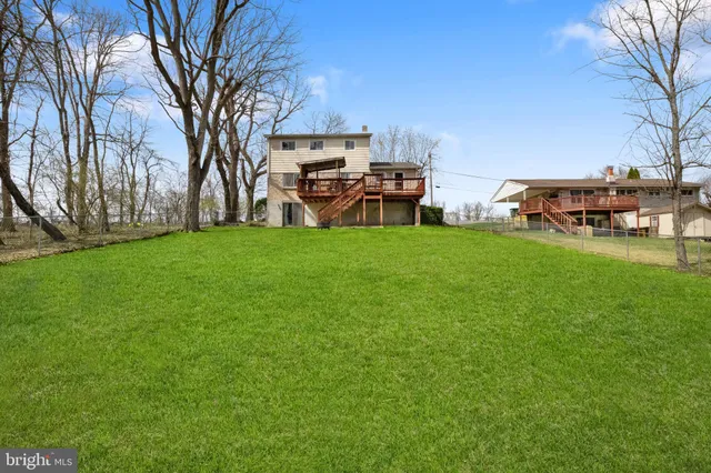a house that has a tree in front of it